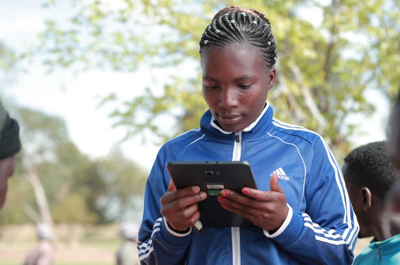 Woman with a tablet in Tanzania