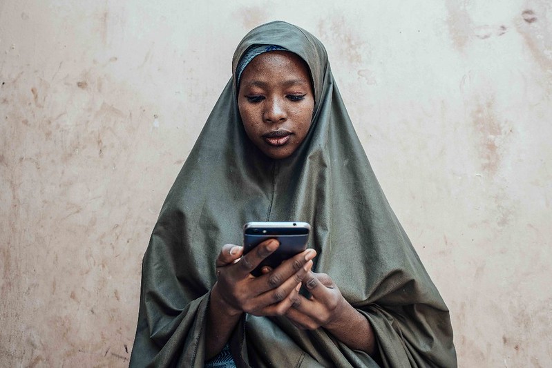 Woman with a phone in Nigeria