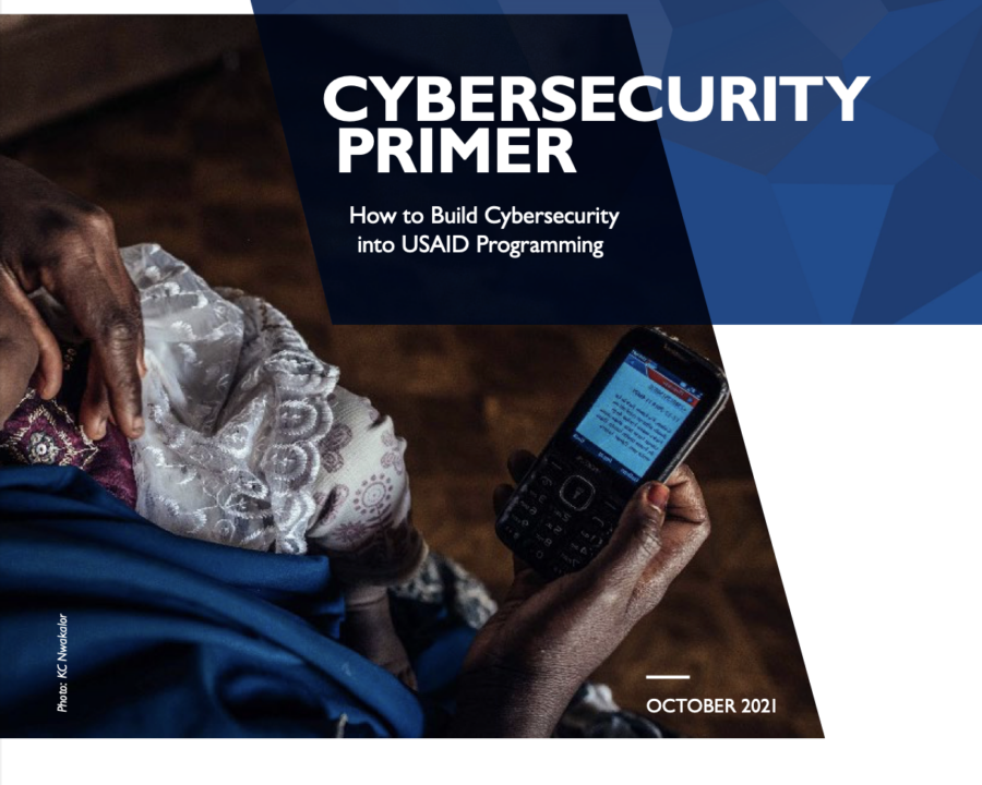 A woman holding a phone on the cover of the USAID Cybersecurity Primer document.