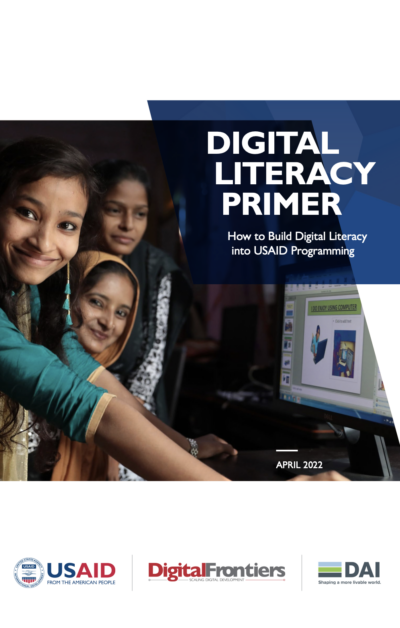 Three women smiling on the cover of the Digital Literacy Primer.