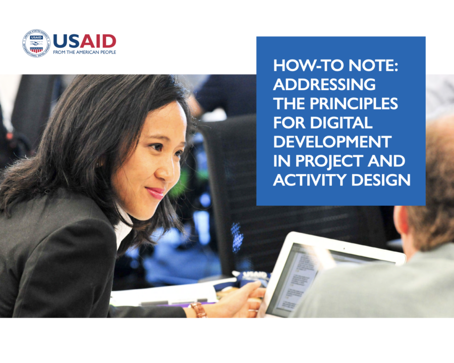 Woman looks at man using a computer. Cover photo for the Principles for Digital Development How-To-Note.